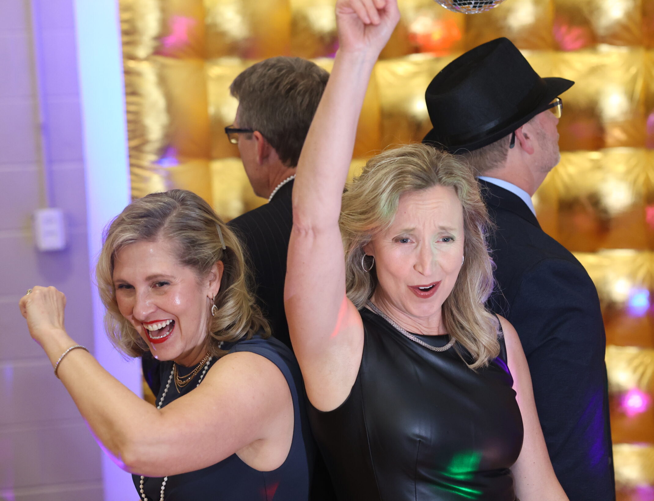 Older couples dancing under 360 photo booth